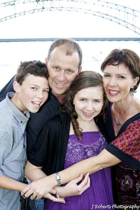 Group hug family of 4 - family portrait photography sydney